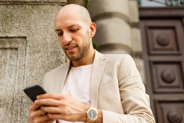 istock Young Business Man Looking At Smart Phone 1394812743