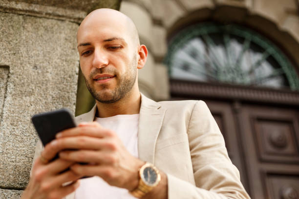 istock Young Business Man Looking At Smart Phone 1394812851