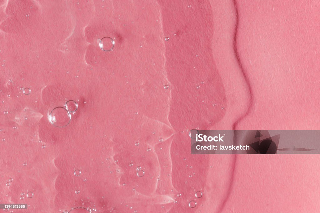 Textured backdrop with air bubbles. Gel, serum or hyaluronic acid on light pink background Textured backdrop with air bubbles. Gel, serum or hyaluronic acid on light pink background. Cosmetics, beauty products presentation concept. Trendy colored wallpaper Shower Gel Stock Photo