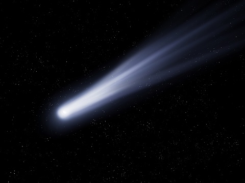 Bright comet at night. Large dust gas trail. Comet Asteroid Meteorite falls to Earth against the night sky.