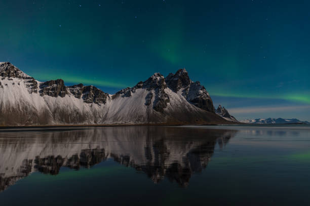 istock Aurora Borealis over mountain Vestrahorn in Iceland 1394817500
