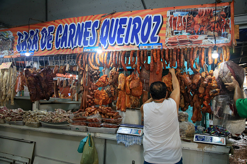 Valencia, Spain - October 30, 2018: Famous Spanish ham Jamon iberico from black Iberian pigs displaying on Central Market in Valencia