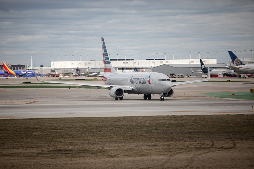 Chicago, Illinois - April 10 2022: An American Airlines airplane taxiing on Chicago O'Hare International Airport