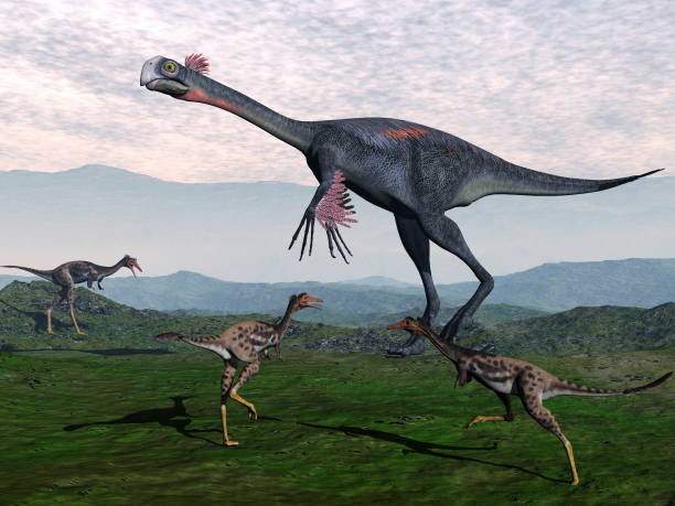 istock Gigantoraptor and small mononykus dinosaurs - 3D render 1394821982