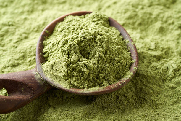 istock Dried barley grass powder on a spoon 1394822175