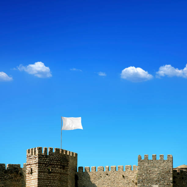Conceptual ancient fortress with white flag
