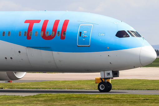 Manchester Airport, United Kingdom - 24 April, 2022: TUI Boeing 787 (G-TUIM) taxiing towards runway 05L for takeoff to Bridgetown, Barbados.