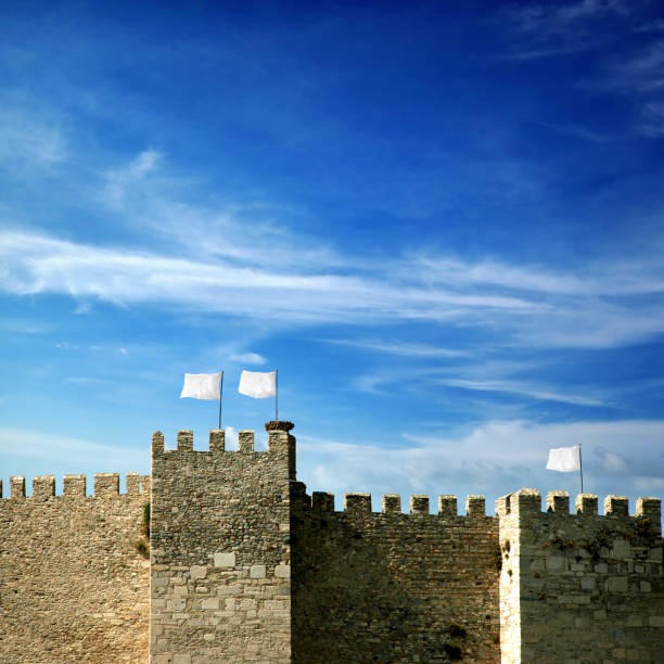 istock Conceptual ancient fortress with white flag 1394823585