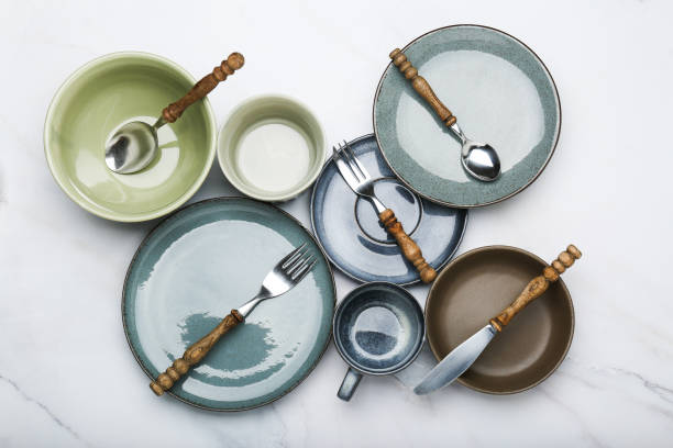 istock set of tableware on a cement background. top view 1394823904