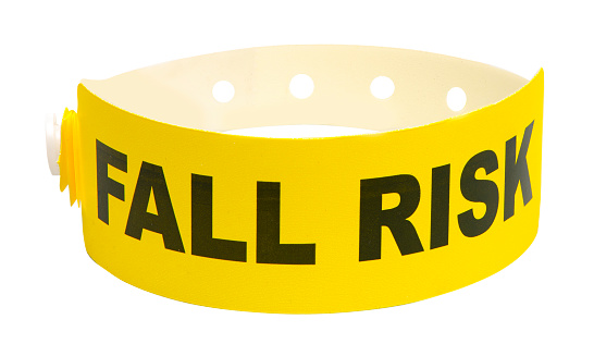 A yellow medical Fall Risk bracelet with clipping path on white background
