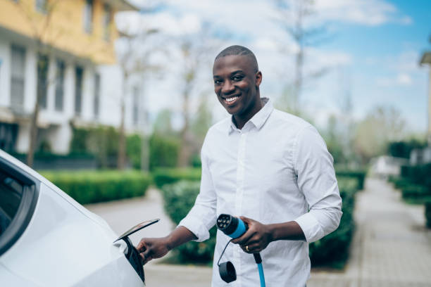istock Man charging electric car 1394827168