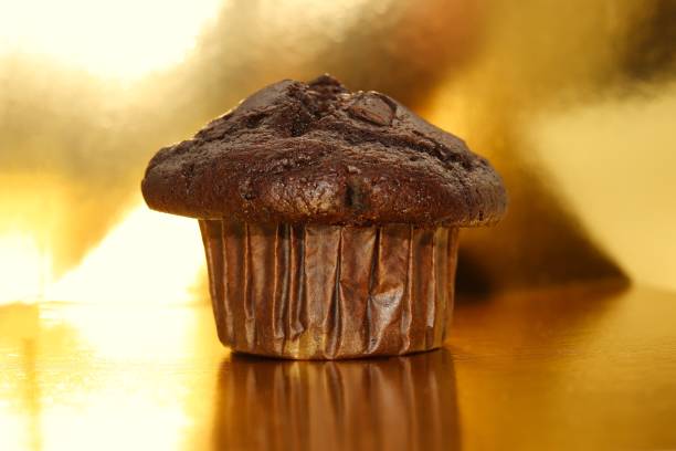 muffin, chocolate, close-up, gold colored background