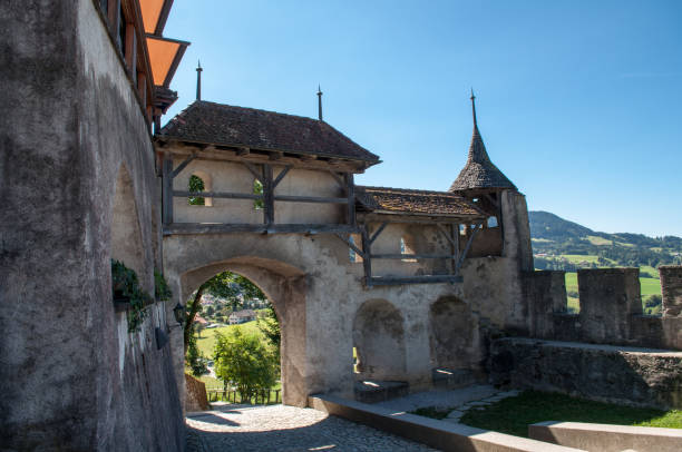 entrance gate to the historic castle of gruyeres in switzerland - fribourg canton imagens e fotografias de stock