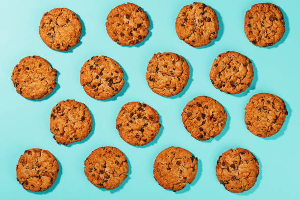 istock Oatmeal cookies with chocolate chip pattern and patterns on a light blue background. 1394828987