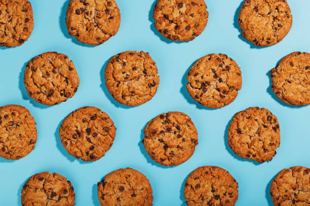 istock Oatmeal cookies with chocolate chip pattern and patterns on a light blue background. 1394829040