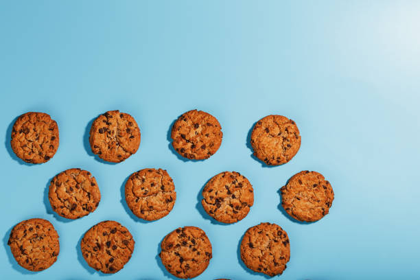 istock Oatmeal cookies with chocolate chip pattern and patterns on a light blue background. 1394829058