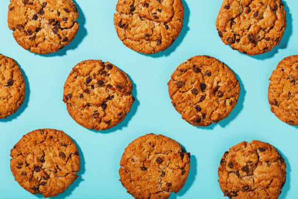 istock Oatmeal cookies with chocolate chip pattern and patterns on a light blue background. 1394829069