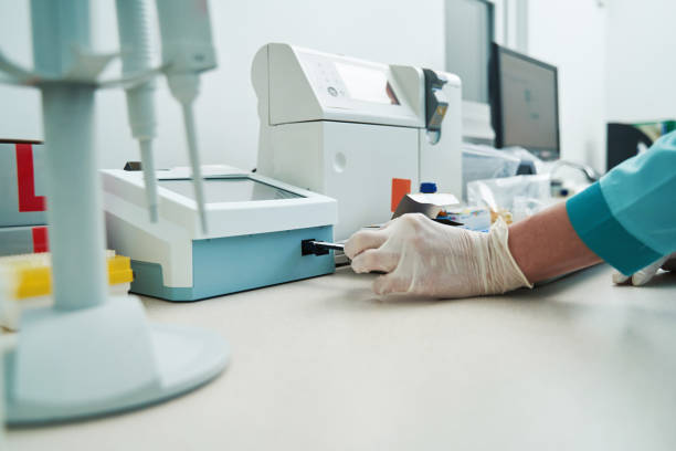 istock Woman researching blood tests with modern equipment 1394829215