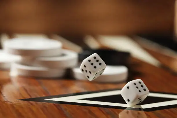 high speed photography of dice rolling in backgammon