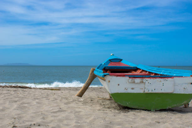istock Small fishing boat at the shore 1394834299