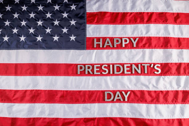 istock words happy presitdents day laid with real letters on US flag surface 1394836912