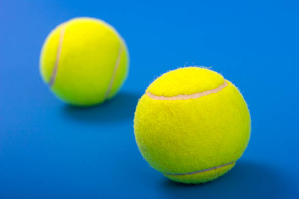 istock Two tennis balls on a blue background 139483905
