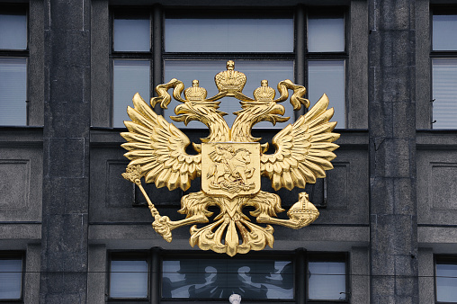 golden coat of arms on the State Duma building in Moscow
