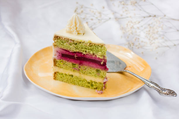 istock a piece of cake on a plate. Confectionery 1394840479