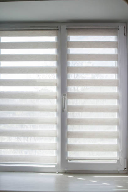 istock Window roller duo system day and night. Close up on roll curtains indoor. 1394841164