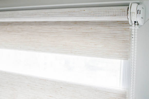 istock Window roller duo system day and night. Close up on roll curtains indoor. 1394841175