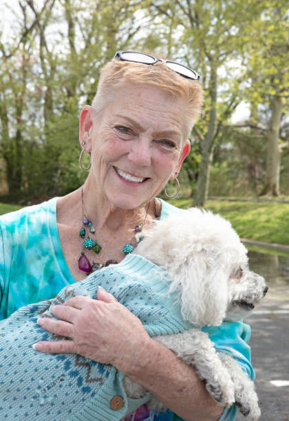 istock Mature Woman Holding Her Bichon 1394841362