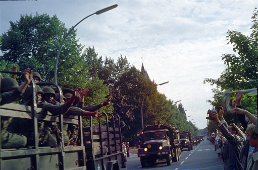 Berlin (West) Germany, 1961. US Army convoy reinforced presence in Berlin (West) after the start of the Wall construction. Also: cheering Berliners.
