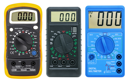 Multimeters for measurement of voltage, a current, resistance. Isolated on a white background.