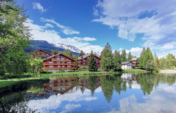 Crans-Montana, Valais, Switzerland Chalets and lake at Crans-Montana by beautiful day, Valais, Switzerland crans montana stock pictures, royalty-free photos & images