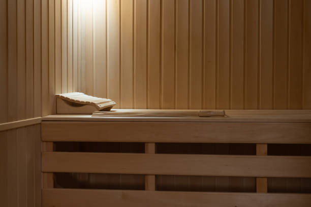 istock Small home sauna trimmed with linden wood. 1394844069