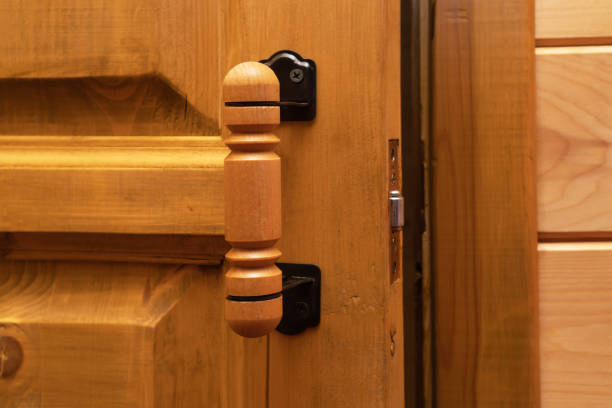 istock Wooden old ajar door with handle. 1394844145