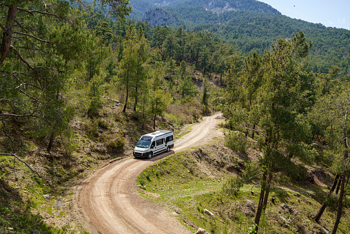 Motorhome driving through forest road near Antalya, Turkey