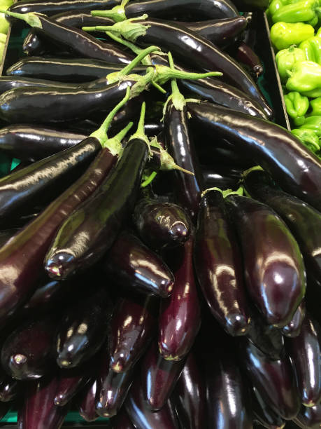 istock Eggplants on the market stall 1394851463