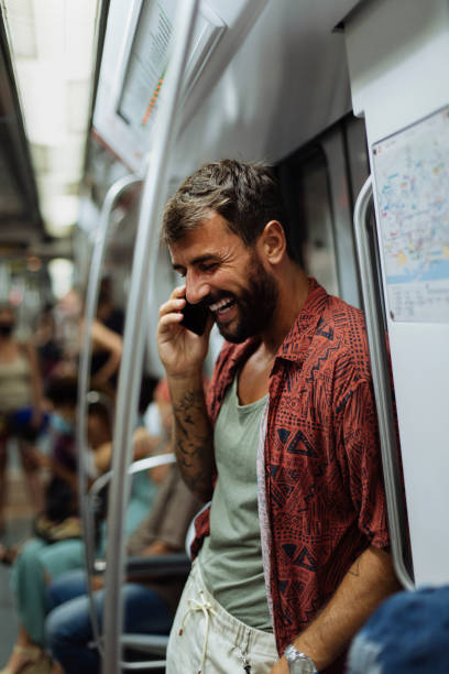 istock Using his time in transit to call his friends 1394851637