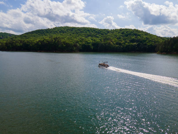 istock Pontoon Boat at Full Throttle On Lake 1394852367