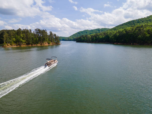 Pontoon Boat at Full Throttle On Lake