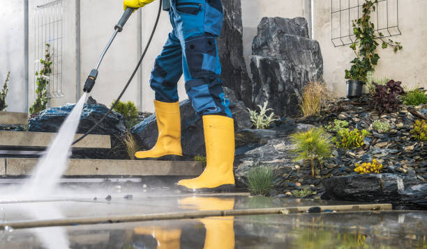 istock Men Pressure Washing His Garden Architectural Concrete Elements 1394853265