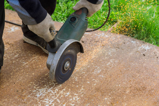 istock Worker cuting a metal surface with a hands saw 1394855539
