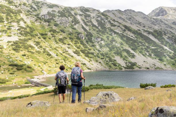 istock A young couple hiking in the mountains 1394859126