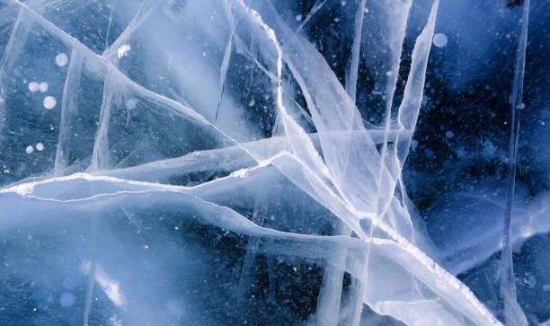 istock Ice surface of Baikal lake in Siberia with cracks. 1394859154