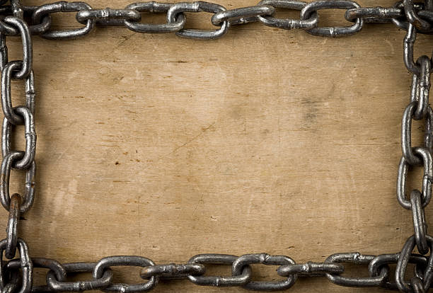 metal chain on old wood background texture