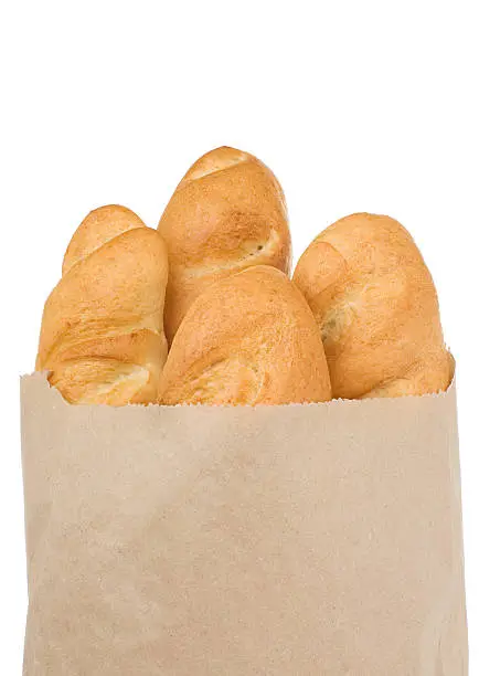 bread isolated in paper bag on white
