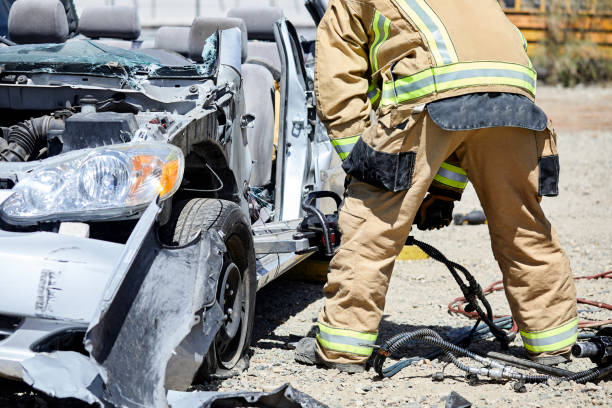 istock Fire Fighters using the Jaws of Life to dismantle a car 1394866030