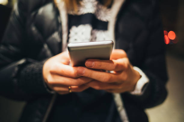 istock Close-up of young woman's hands use smartphone 1394867707