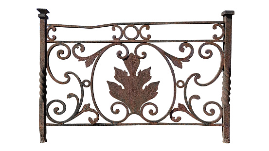 ancient rusty forged element of the fence. rounded ornament with an oak leaf in the center. isolated on white background